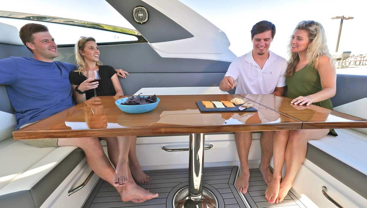 Couples eating at the table in cockpit seating